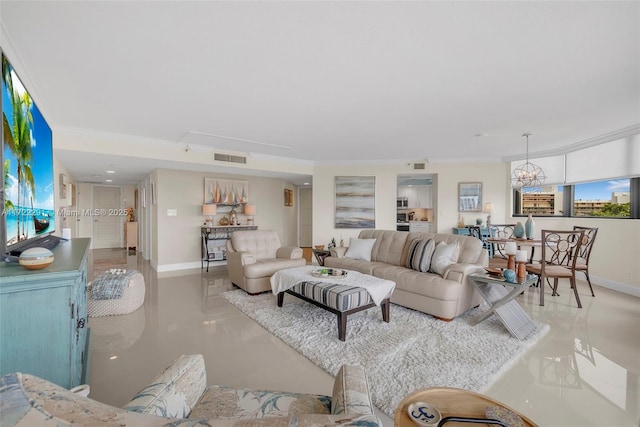 living room with a chandelier and crown molding