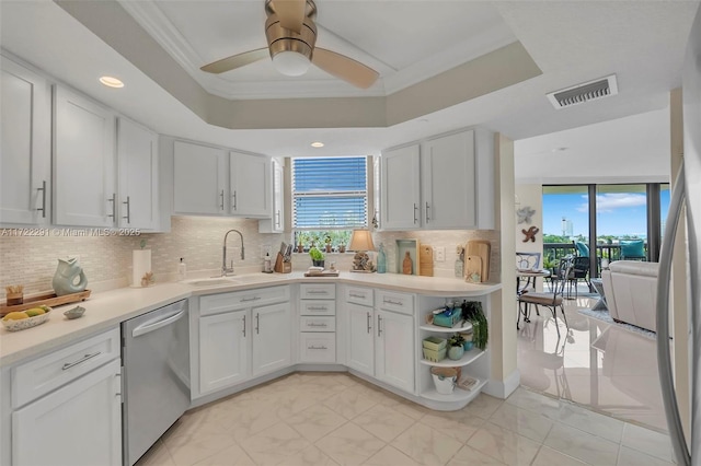 kitchen with white cabinetry, dishwasher, and sink