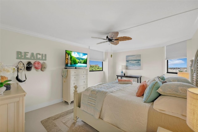 bedroom with ceiling fan, ornamental molding, and multiple windows