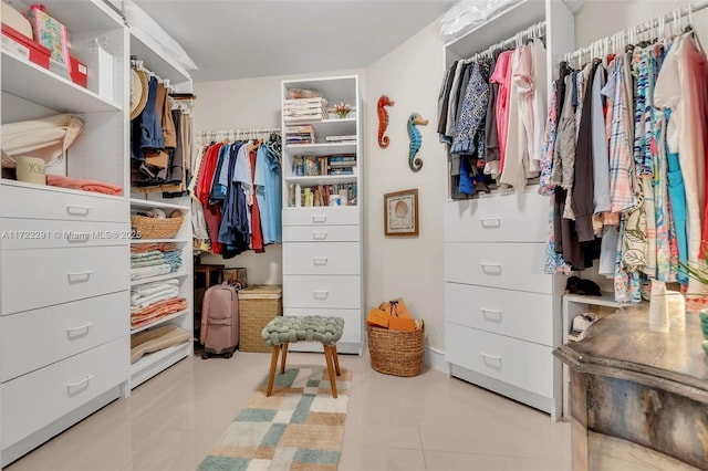 spacious closet featuring light tile patterned floors