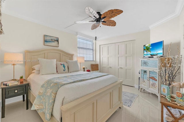 tiled bedroom with ceiling fan, crown molding, and a closet