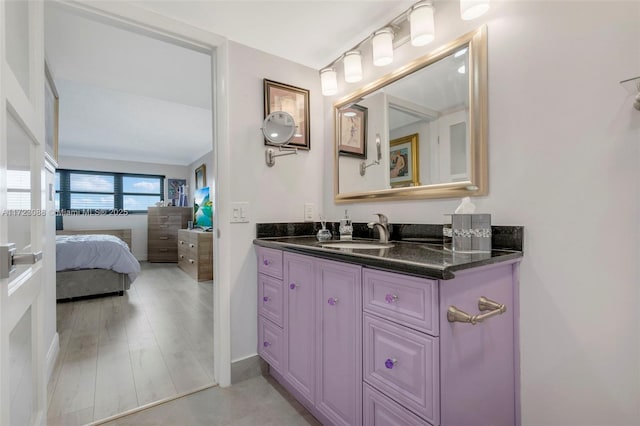 bathroom featuring vanity and ornamental molding