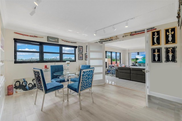 dining area featuring crown molding and hardwood / wood-style floors