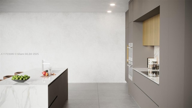 kitchen with white oven, gray cabinetry, and black electric cooktop