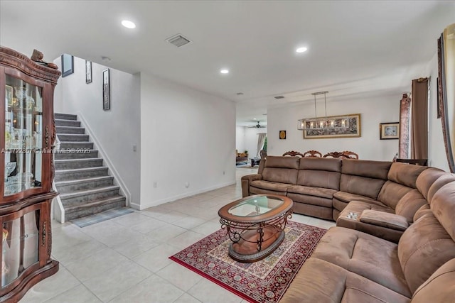 tiled living room with ceiling fan