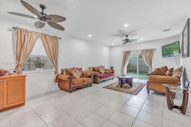 tiled living room featuring ceiling fan