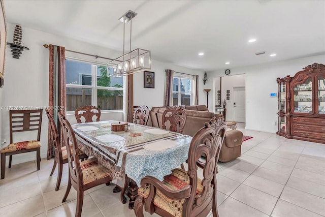 dining space featuring light tile patterned floors