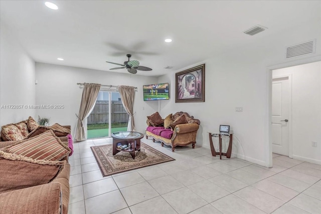 living room featuring ceiling fan and light tile patterned flooring