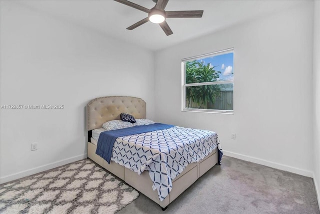 bedroom featuring light colored carpet and ceiling fan