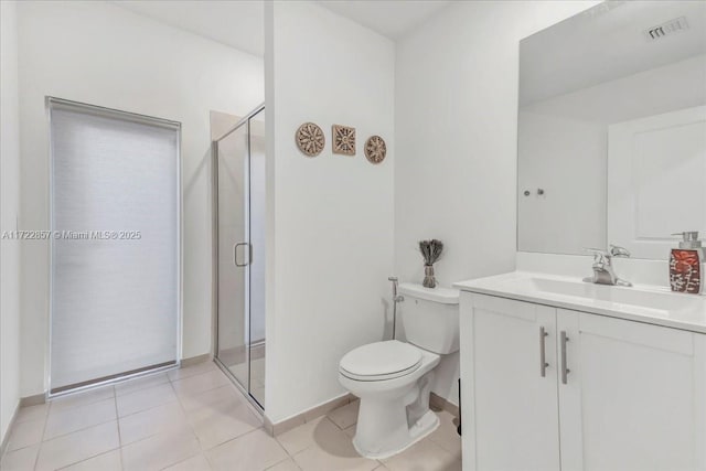 bathroom with tile patterned flooring, vanity, toilet, and an enclosed shower