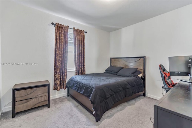 bedroom with light carpet