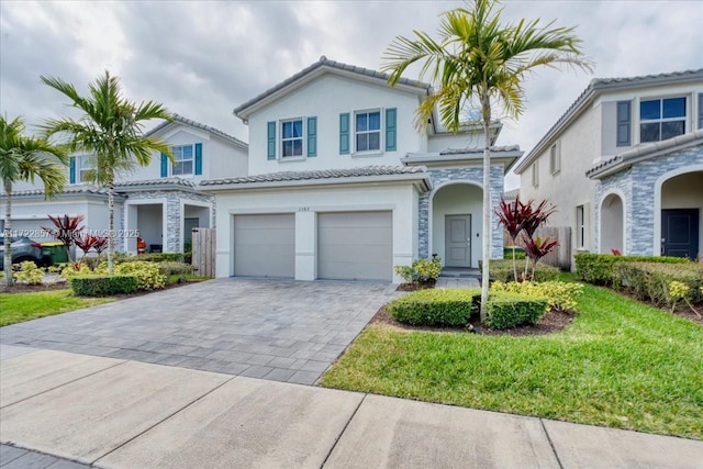 view of front facade with a front yard and a garage