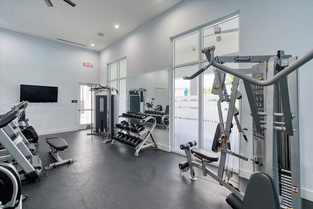 gym featuring a towering ceiling