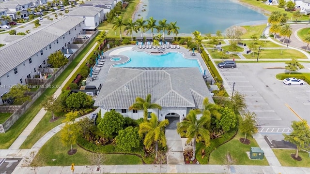 birds eye view of property featuring a water view