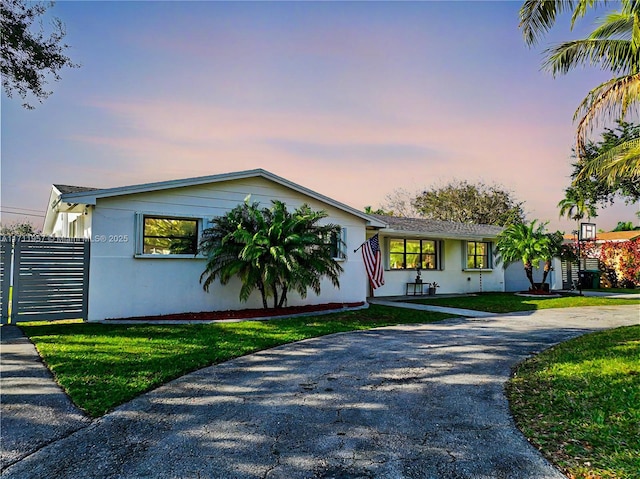 view of front of property with a lawn