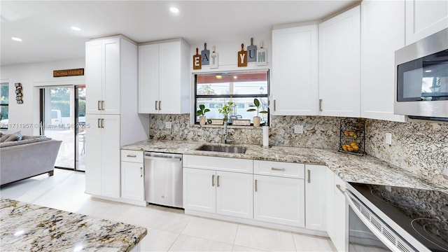 kitchen featuring white cabinets, sink, and appliances with stainless steel finishes