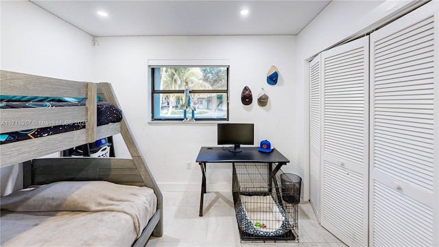 tiled bedroom with a closet