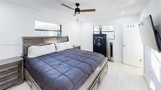 tiled bedroom featuring multiple windows and ceiling fan