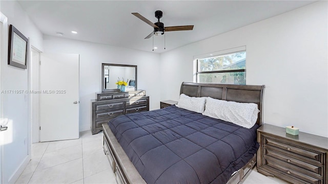 tiled bedroom featuring ceiling fan