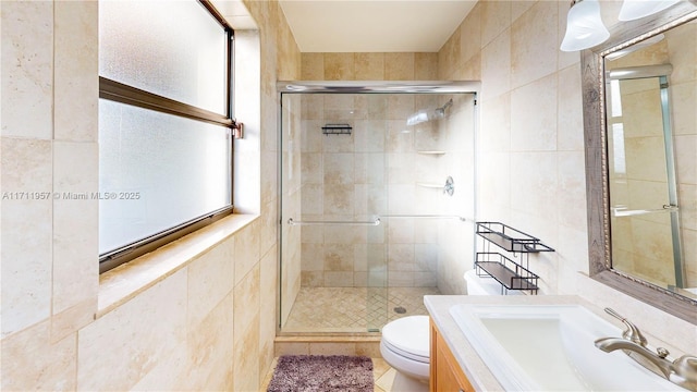 bathroom with toilet, sink, tile walls, and walk in shower