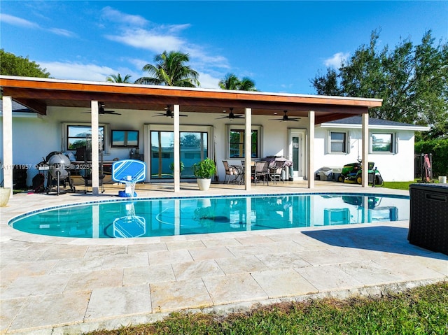 view of pool featuring ceiling fan and a patio