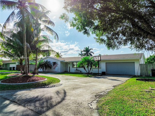 view of front of house featuring a front yard and a garage