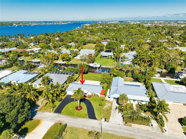 birds eye view of property featuring a water view and a residential view