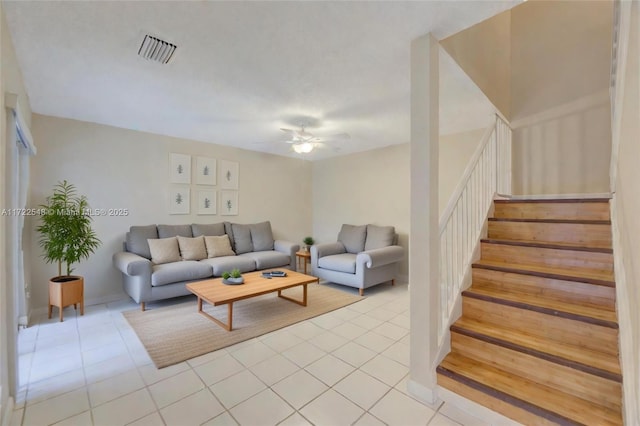 tiled living room with ceiling fan