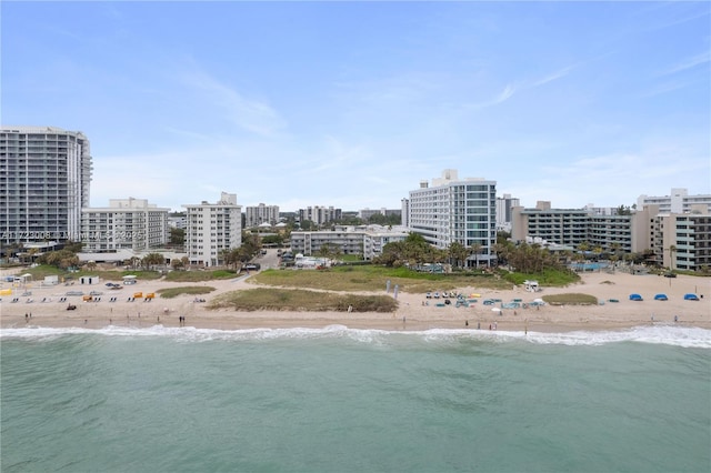 bird's eye view featuring a water view and a view of the beach