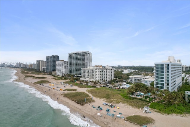 bird's eye view featuring a beach view and a water view