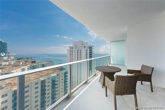 balcony featuring a water view