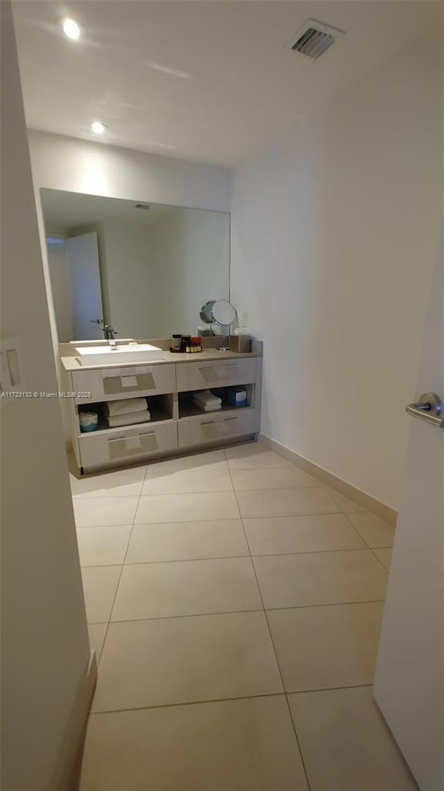 bathroom featuring tile patterned flooring and sink