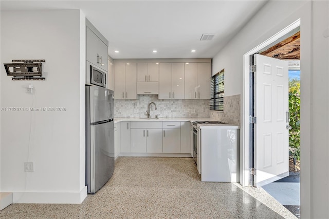 kitchen featuring backsplash, sink, and stainless steel appliances