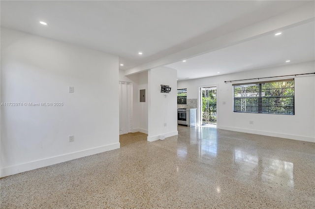 unfurnished room featuring electric panel