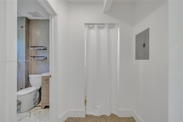 bathroom with vanity, electric panel, toilet, and tile walls