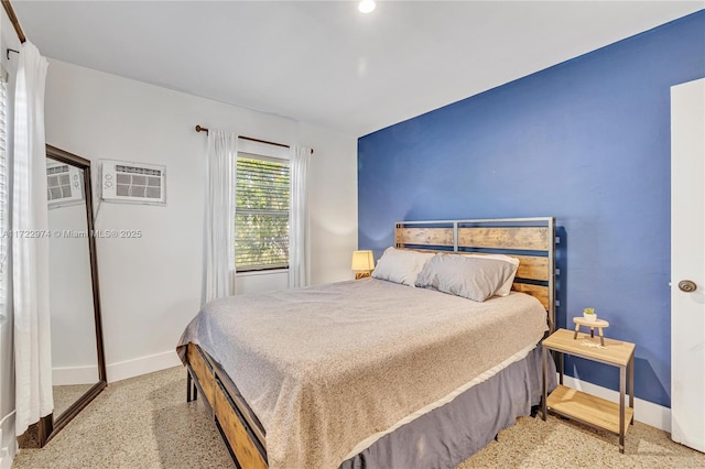 bedroom with a wall unit AC