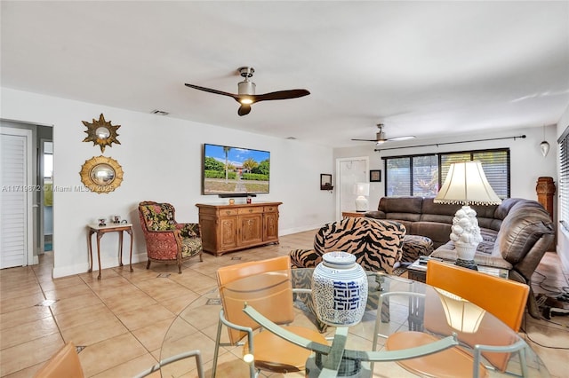 dining room featuring ceiling fan and light tile patterned floors