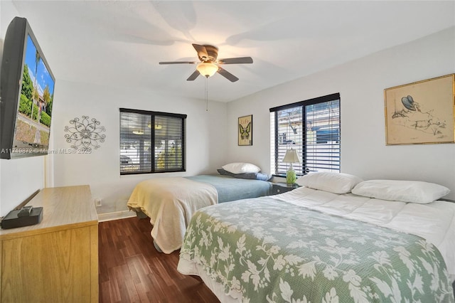 bedroom featuring ceiling fan and dark hardwood / wood-style floors