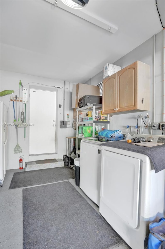 kitchen featuring light brown cabinets, washer and clothes dryer, and white refrigerator with ice dispenser