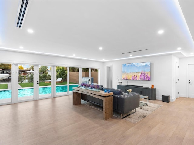 living room featuring light hardwood / wood-style flooring and french doors