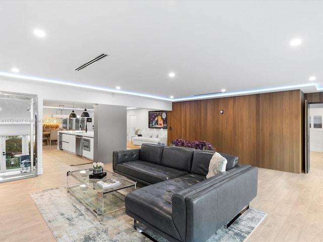 living room with light hardwood / wood-style floors