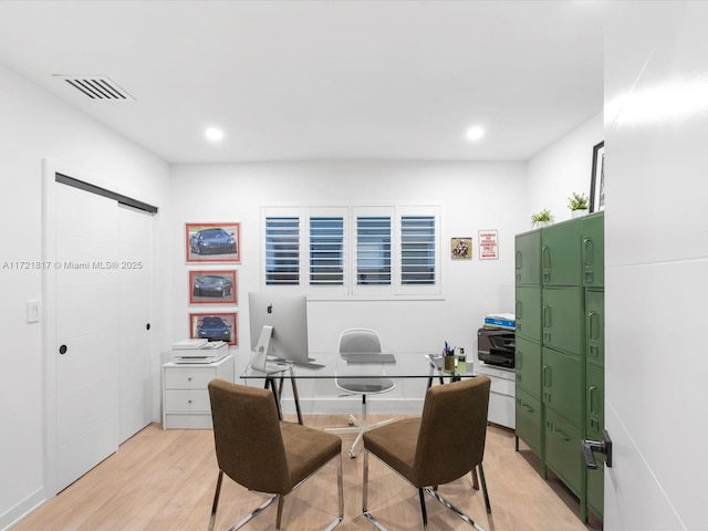 office area with light hardwood / wood-style flooring