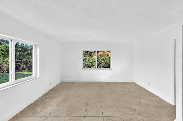 spare room with light tile patterned floors