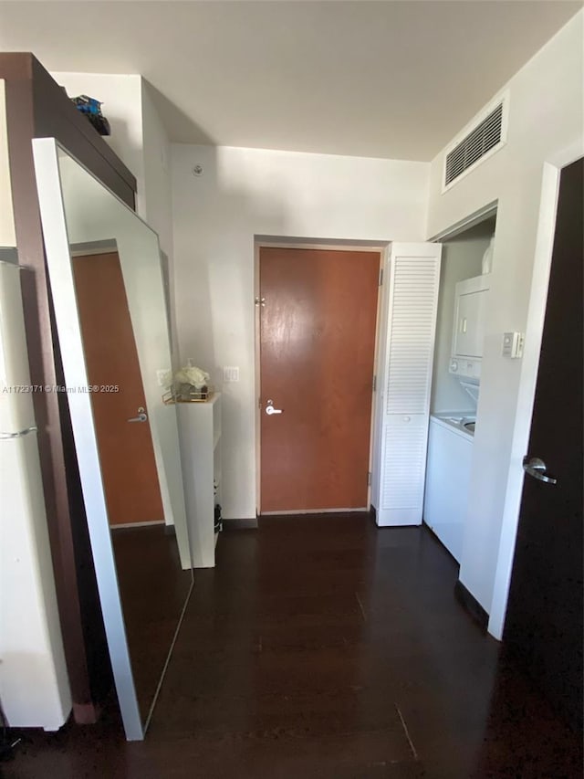 hall with dark hardwood / wood-style floors