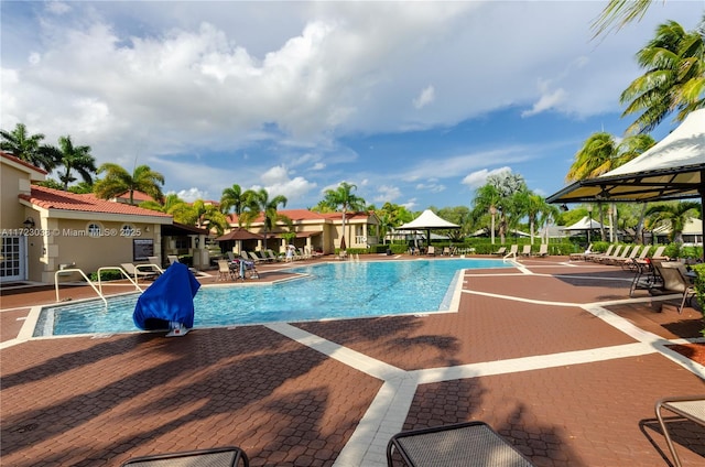 view of swimming pool featuring a gazebo and a patio area