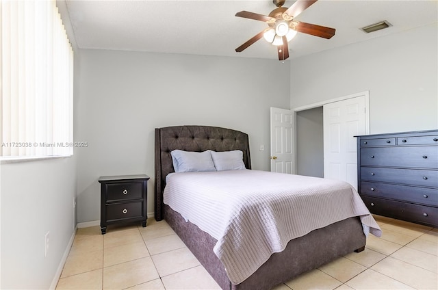 tiled bedroom with ceiling fan