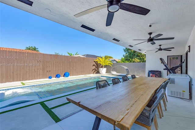 view of patio with a fenced in pool