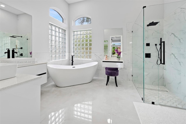 bathroom with plus walk in shower, vanity, and tile walls