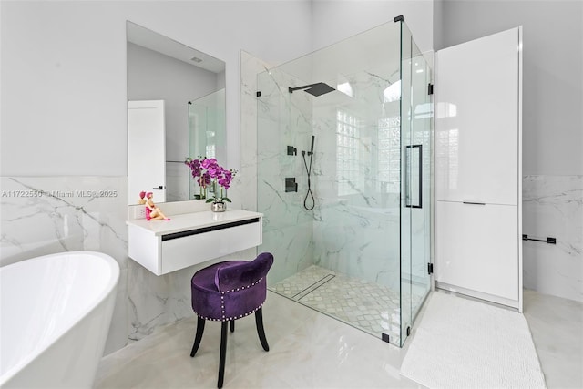 bathroom featuring tile walls and shower with separate bathtub