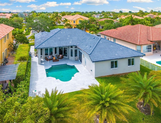 view of pool featuring a lawn, outdoor lounge area, and a patio area